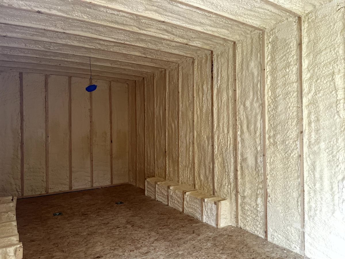 Closed cell spray foam insulation applied to wall framing